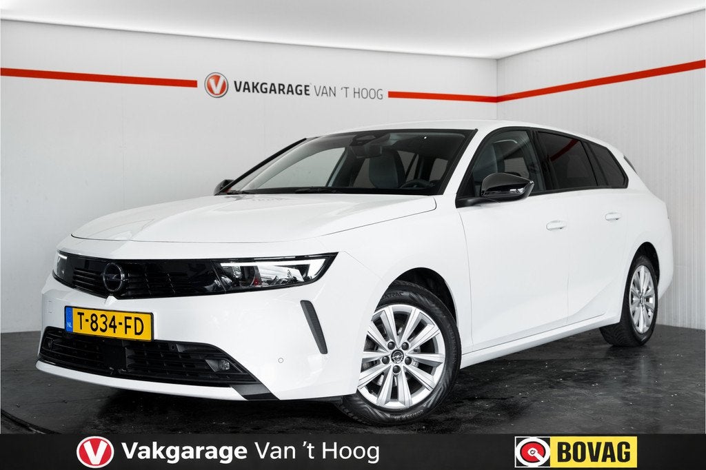 Opel Astra Sports Tourer 1.2 Turbo|Trekhaak| (bj 2023), Auto's, Stof, Gebruikt, 1199 cc, Wit