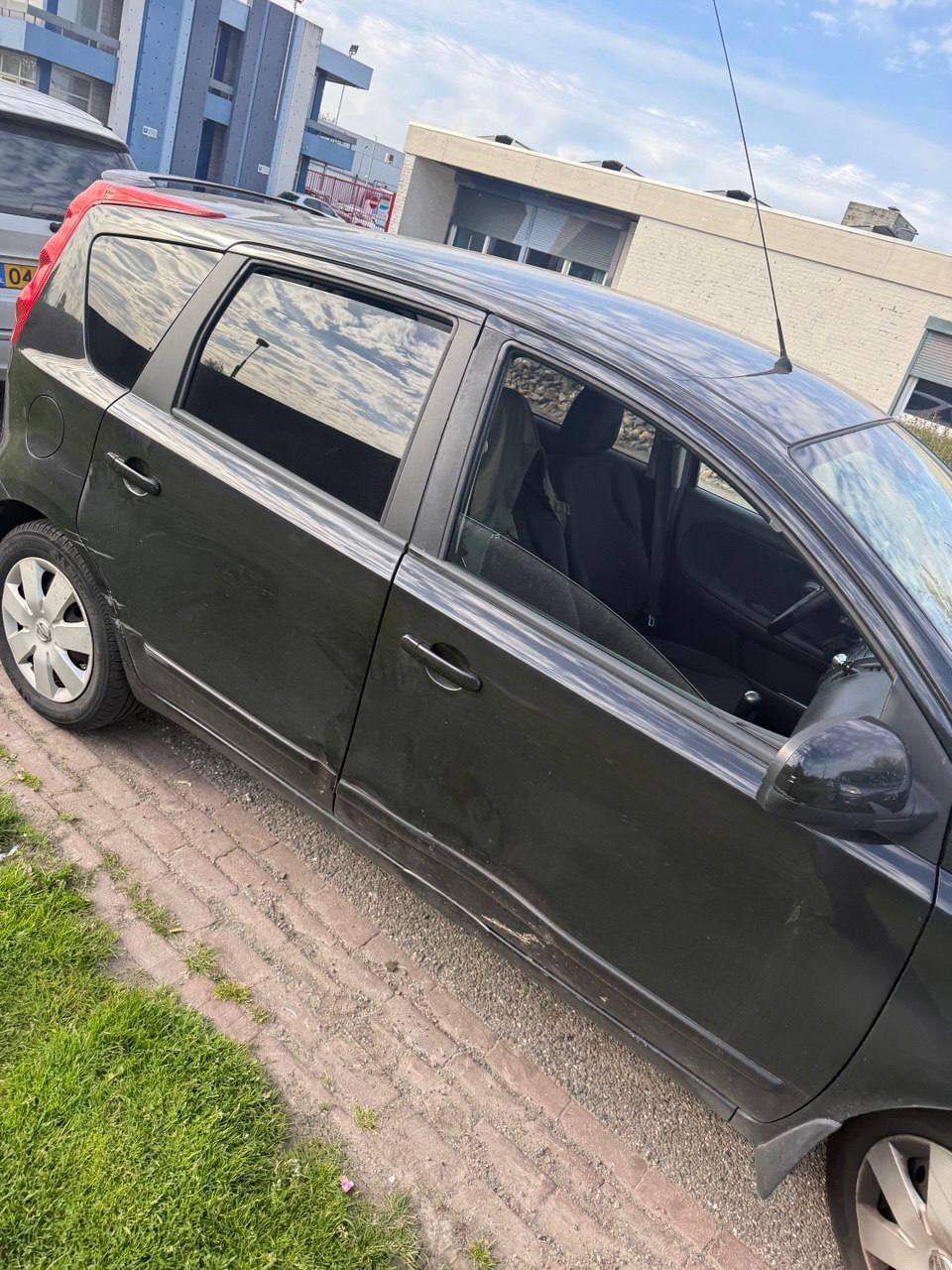 Nissan Note 1.4 16V 2006 Zwart, Auto's, Euro 5, 40 €/maand, Zwart, 4 cilinders