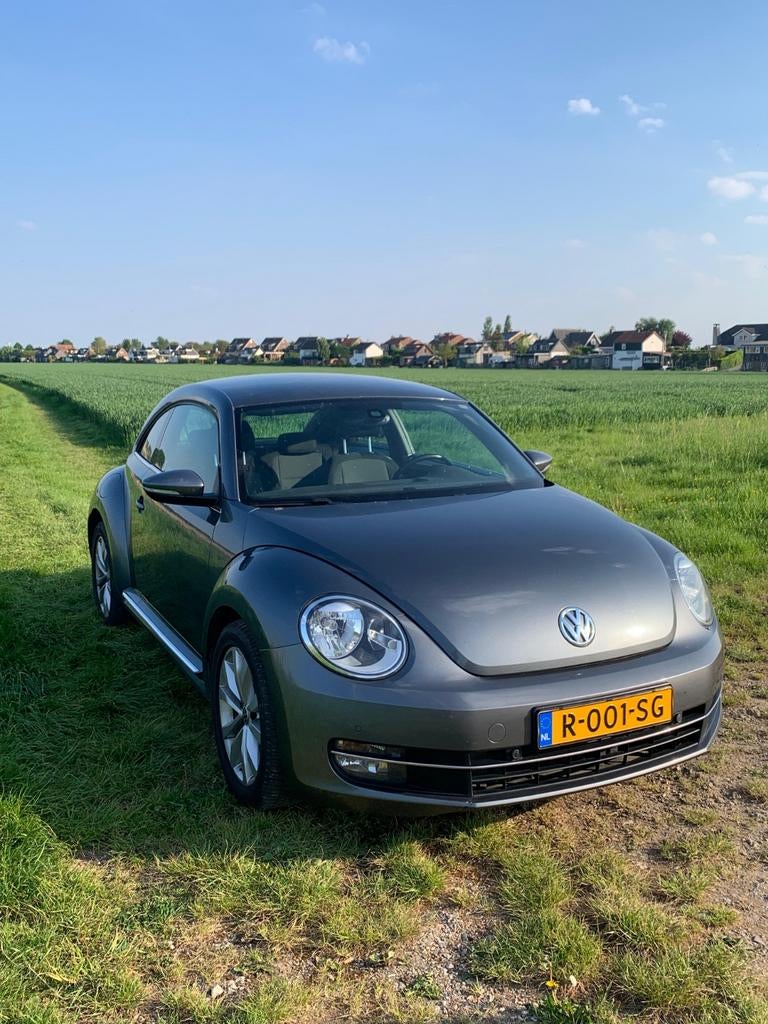 Volkswagen Beetle (Kever) 1.2 TSI 77KW BMT 2012 Grijs, Auto's, Volkswagen, Voorwielaandrijving, Stof, Beetle (Kever), 4 cilinders