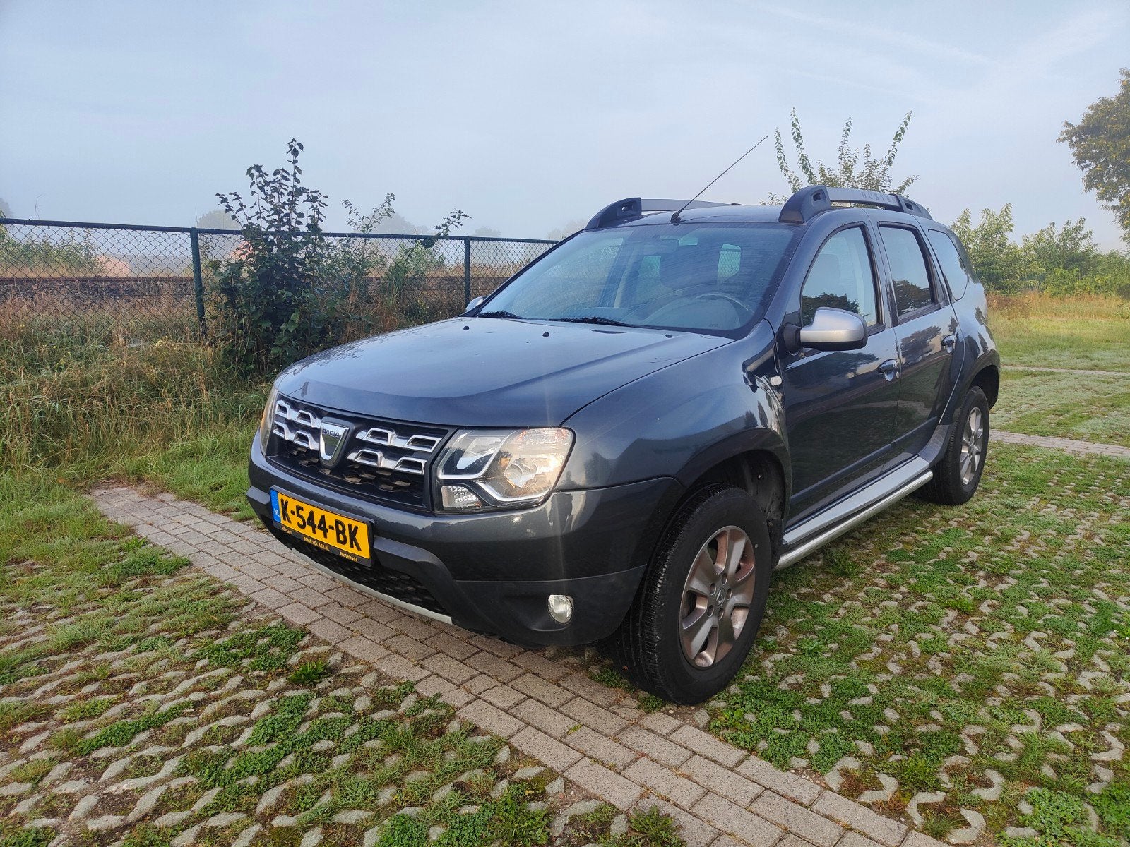Dacia Duster 1.2 TCE 125 4X2 2014 Grijs, Auto's, Voorwielaandrijving, Euro 5, 125 pk, Zwart