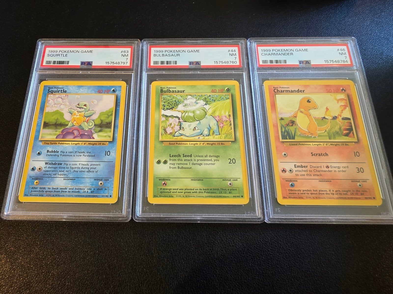 Pokémon PSA 7 NM 1999 Squirtle, Bulbasaur, Charmander, Ophalen of Verzenden, Zo goed als nieuw, Meerdere kaarten