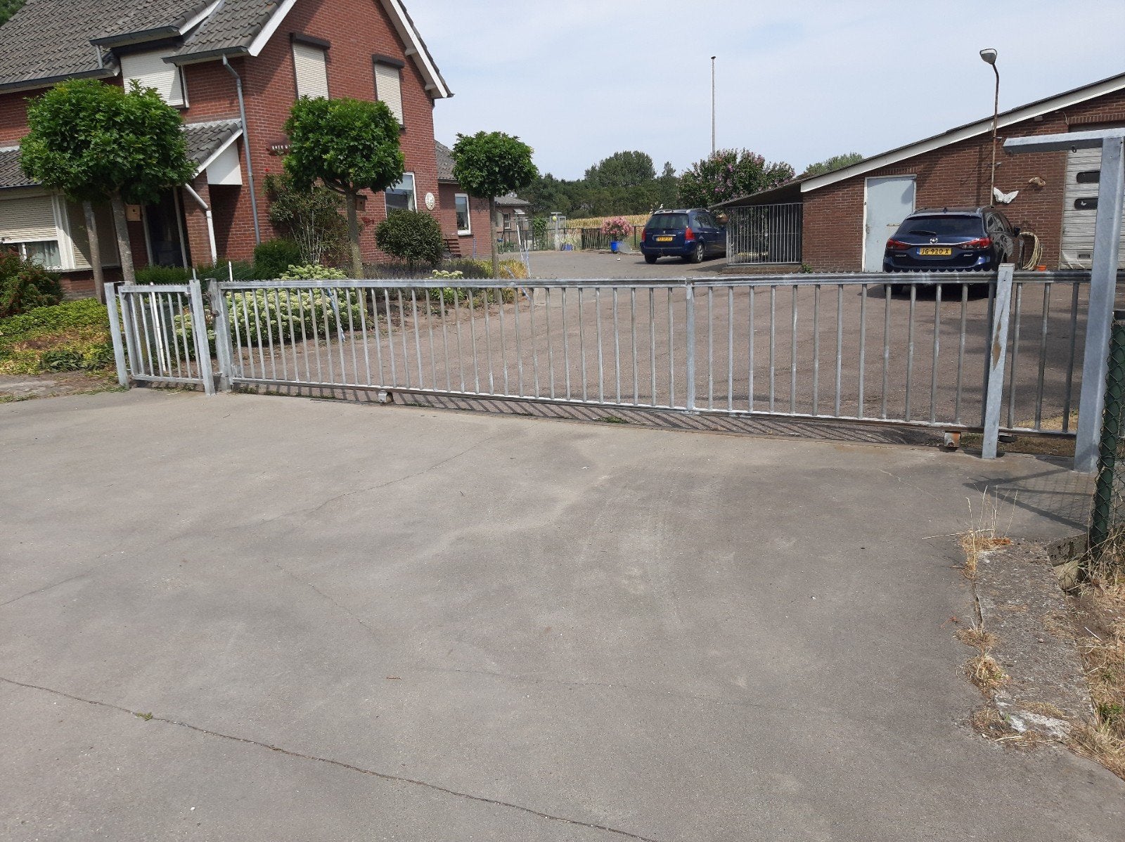 heras a44 Verzinkte rolpoort met loopdeur - 8,75m breed, 1,1, Tuin en Terras, Tuinhekken en Hekwerk, Ophalen, Gebruikt, IJzer