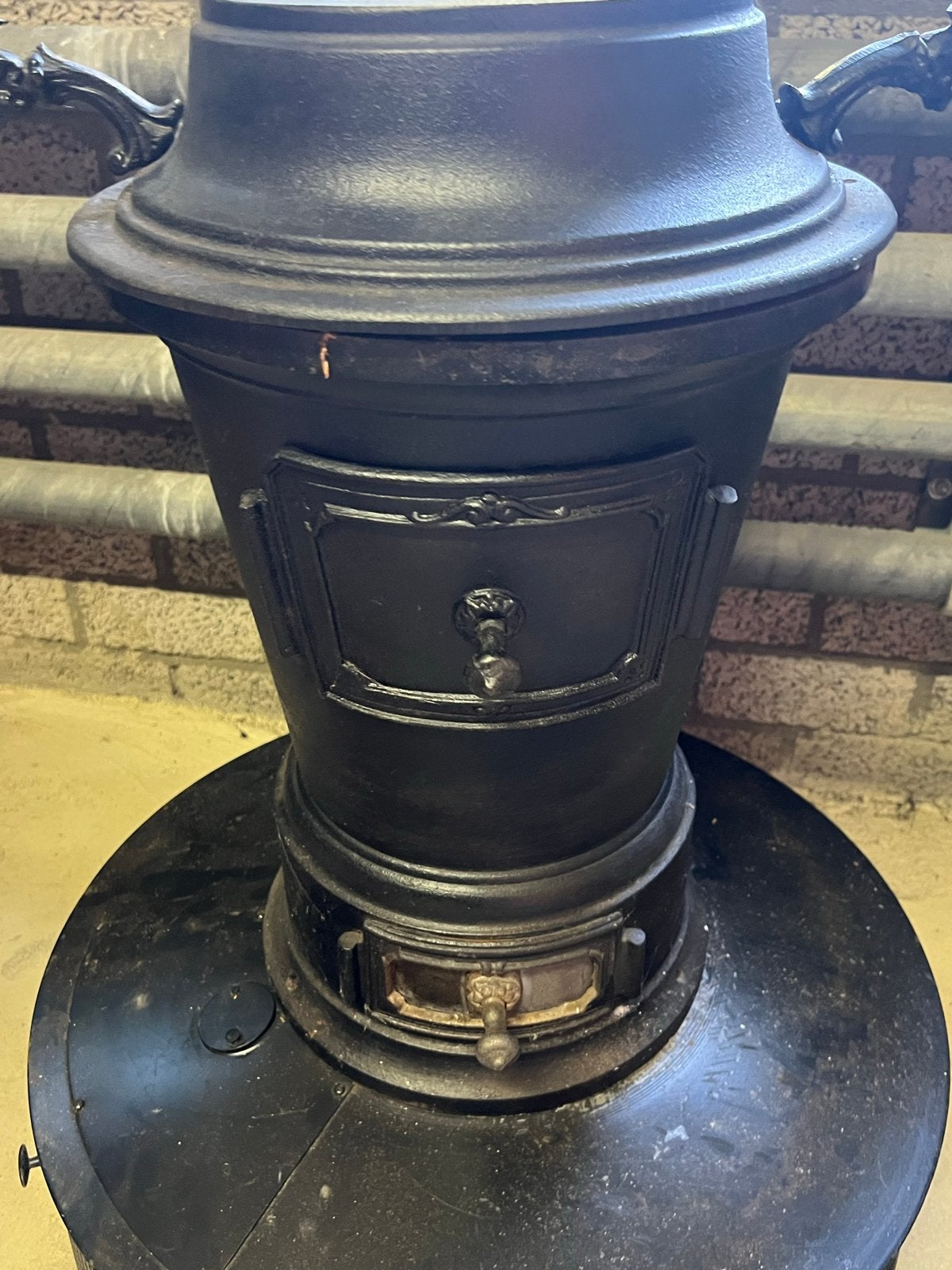 Antieke potkachel (zonder brander)leeuwepootjes, Ophalen