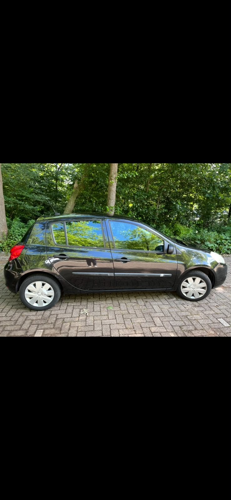 Renault Clio 1.2 16V 55KW 5-DRS E4 2010 Zwart, Auto's, Voorwielaandrijving, 74 pk, Elektrische ramen, 4 cilinders