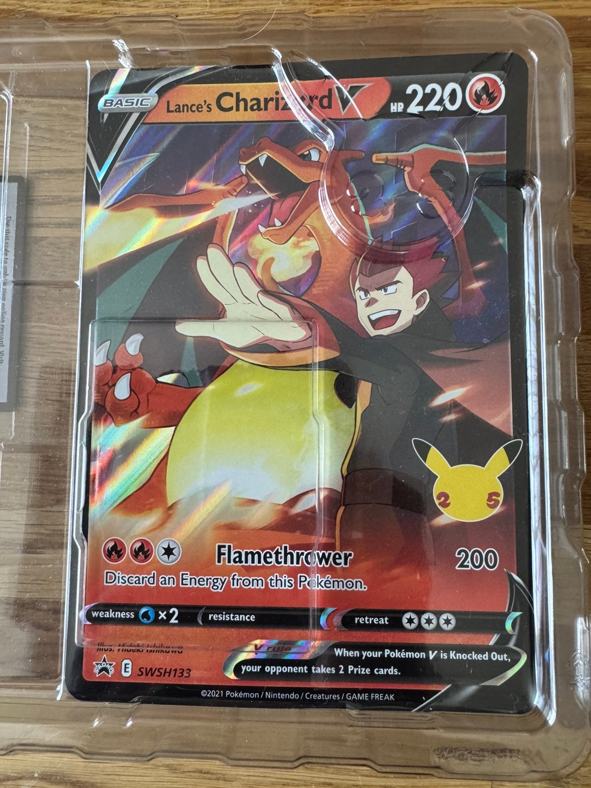 Pokemon Kaart Lance’s Charizard promo Celebrations., Ophalen of Verzenden, Nieuw, Losse kaart, Foil