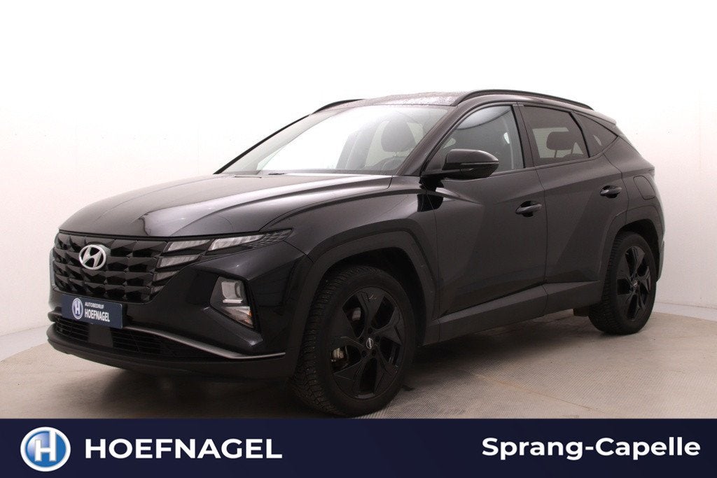 Hyundai Tucson 1.6 T-GDI PHEV Comfort 4WD | Trekhaak | Camer, Auto's, 1350 kg, Stof, Gebruikt, Zwart