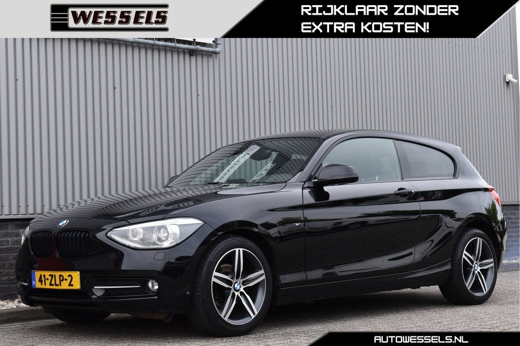 BMW 1-serie 116i Business+ Sport M-stuur, Sport stoelen Auto, Auto's, BMW, Euro 5, 4 cilinders, Zwart, 1598 cc