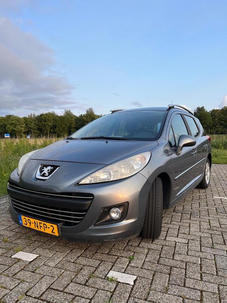 Peugeot 207 1.4 VTI 16V SW 2010 Grijs, Auto's, Peugeot, Voorwielaandrijving, Stof, Origineel Nederlands, Stationwagon