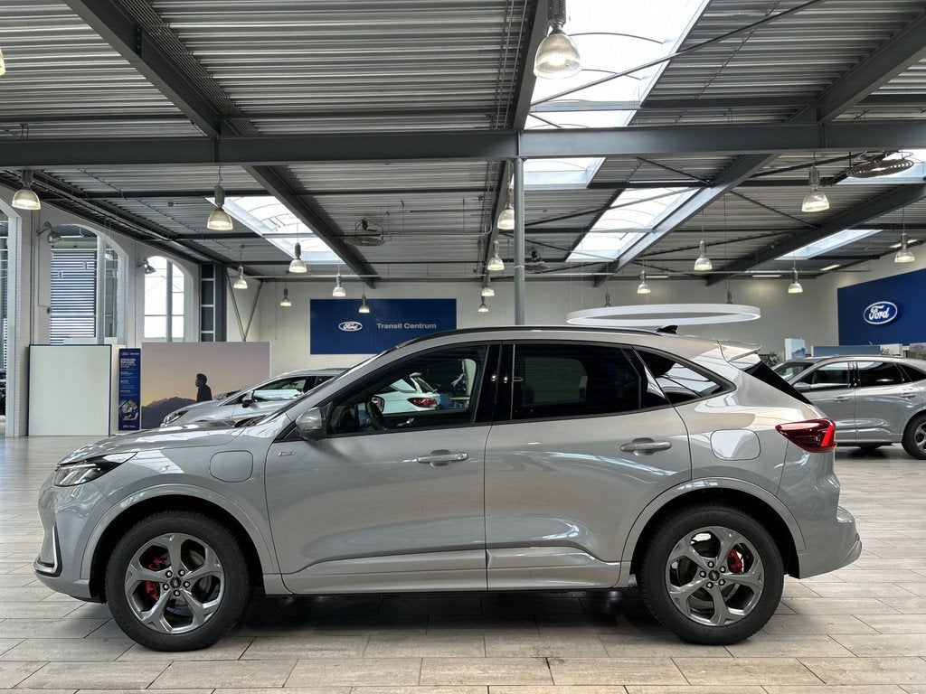 Ford Kuga 2.5 PHEV 243 pk ST-Line X I AGR stoelen | Adapt Cr, Auto's, Ford, 12 maanden, 14 kWh, Gebruikt, Zwart