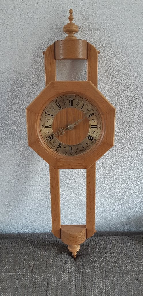 licht eikenhouten wandklok, Ophalen