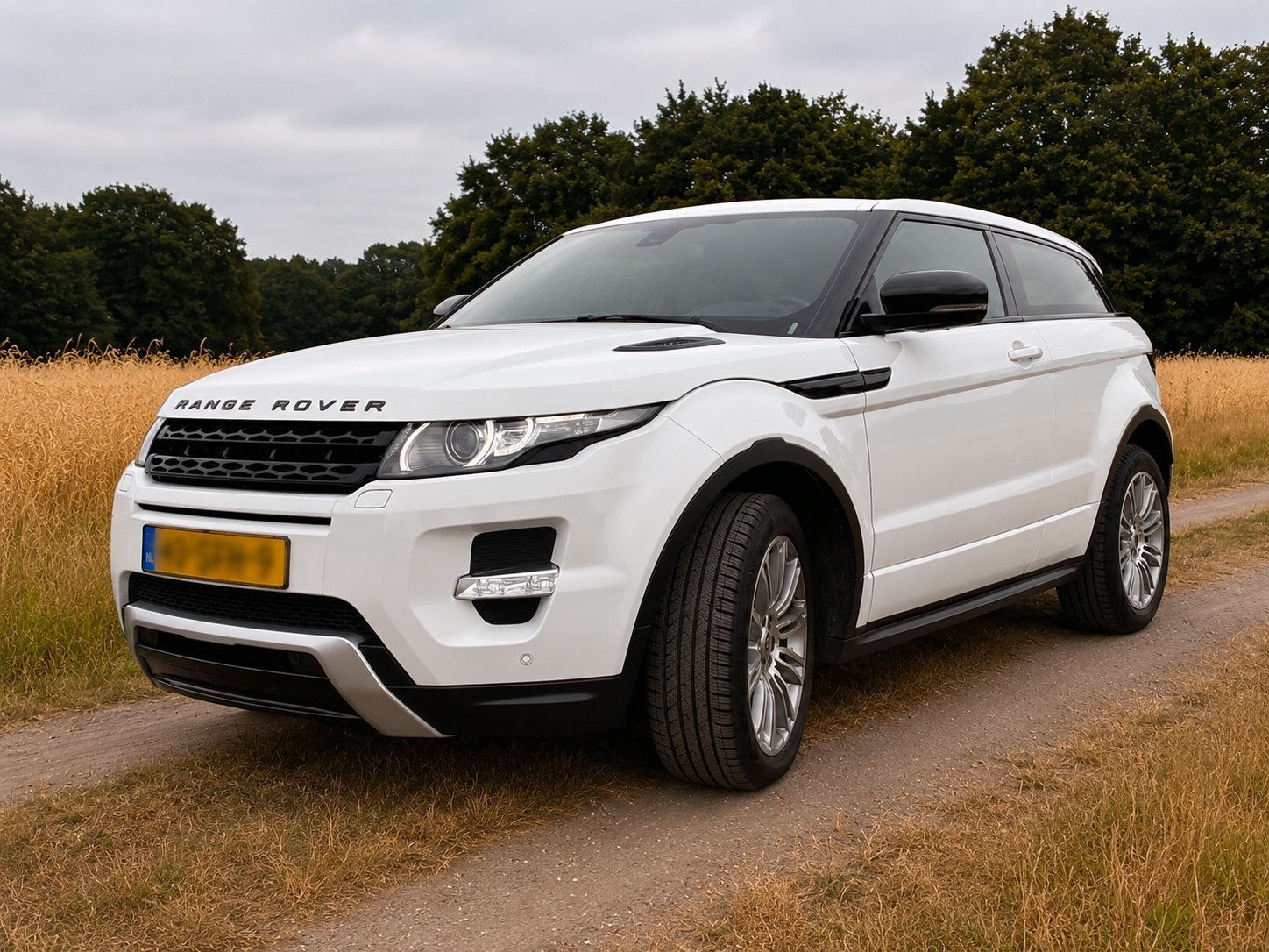 Land Rover Range Rover Evoque SI4 4WD Coupe AUT 2011 Wit, Auto's, Automaat, 1800 kg, Zwart, 4 cilinders