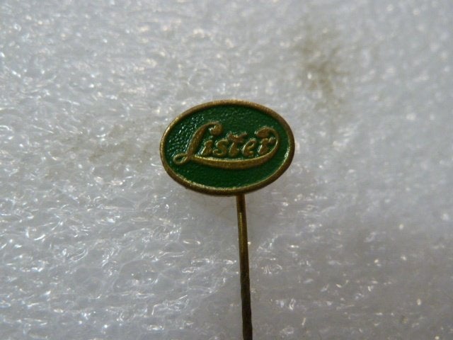 Vintage Lister speldje - Groen met gouden letters, Ophalen of Verzenden, Gebruikt, Merk, Speldje of Pin