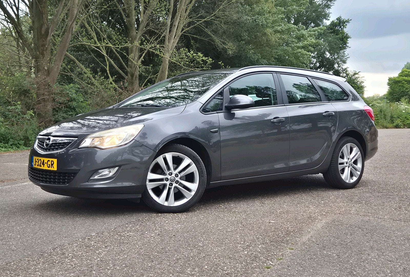 Opel Astra 1.4 Turbo 103KW 5D AUT 2012 Grijs, Auto's, Opel, Voorwielaandrijving, Euro 5, Stof, Zwart