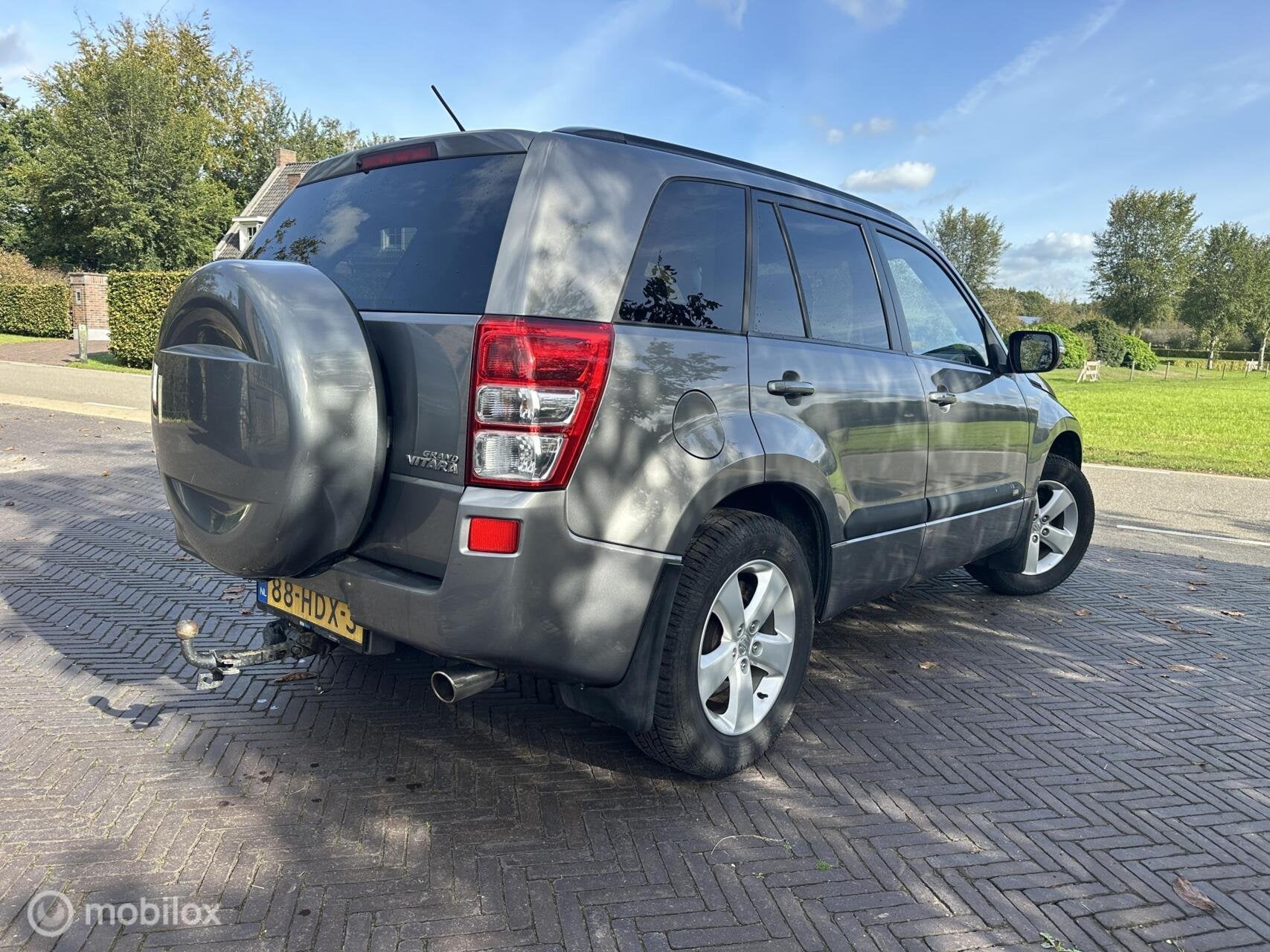 Suzuki Grand Vitara 2.4 Exclusive 4x4 Trekhaak Cruise✅, Stof, Gebruikt, Zwart, 4 cilinders