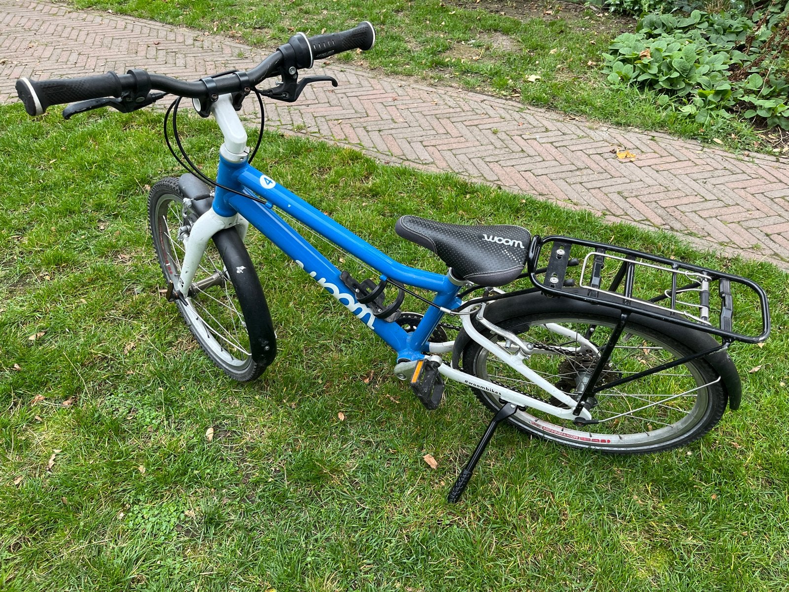 Woom 4 kinderfiets - Blauw, 20 inch, lichtgewicht, Fietsen en Brommers, Ophalen, Gebruikt, Velgrem, 20 inch of meer