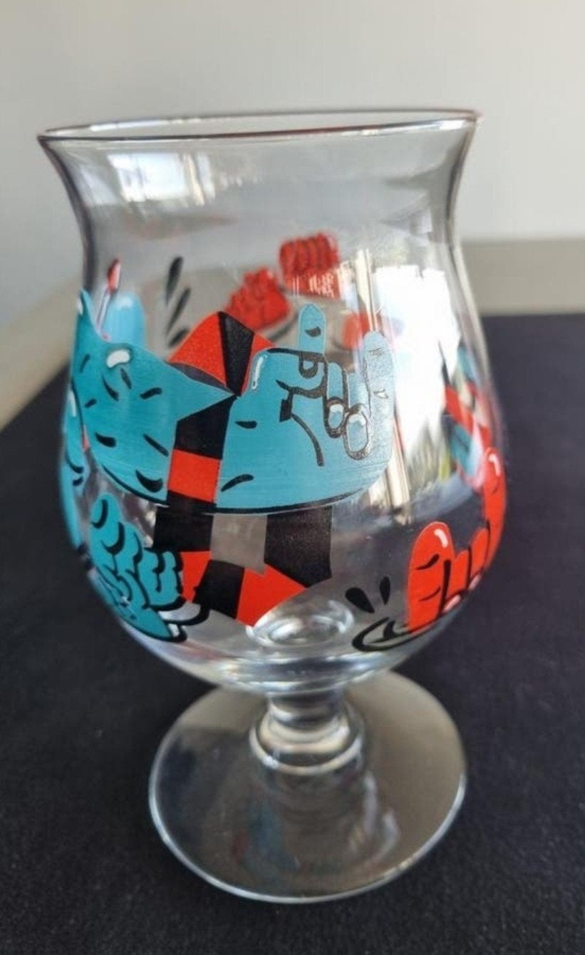 Duvel glas met ontwerp van kunstenares Nina Vandeweghe., Ophalen of Verzenden, Nieuw, Glas of Glazen, Duvel