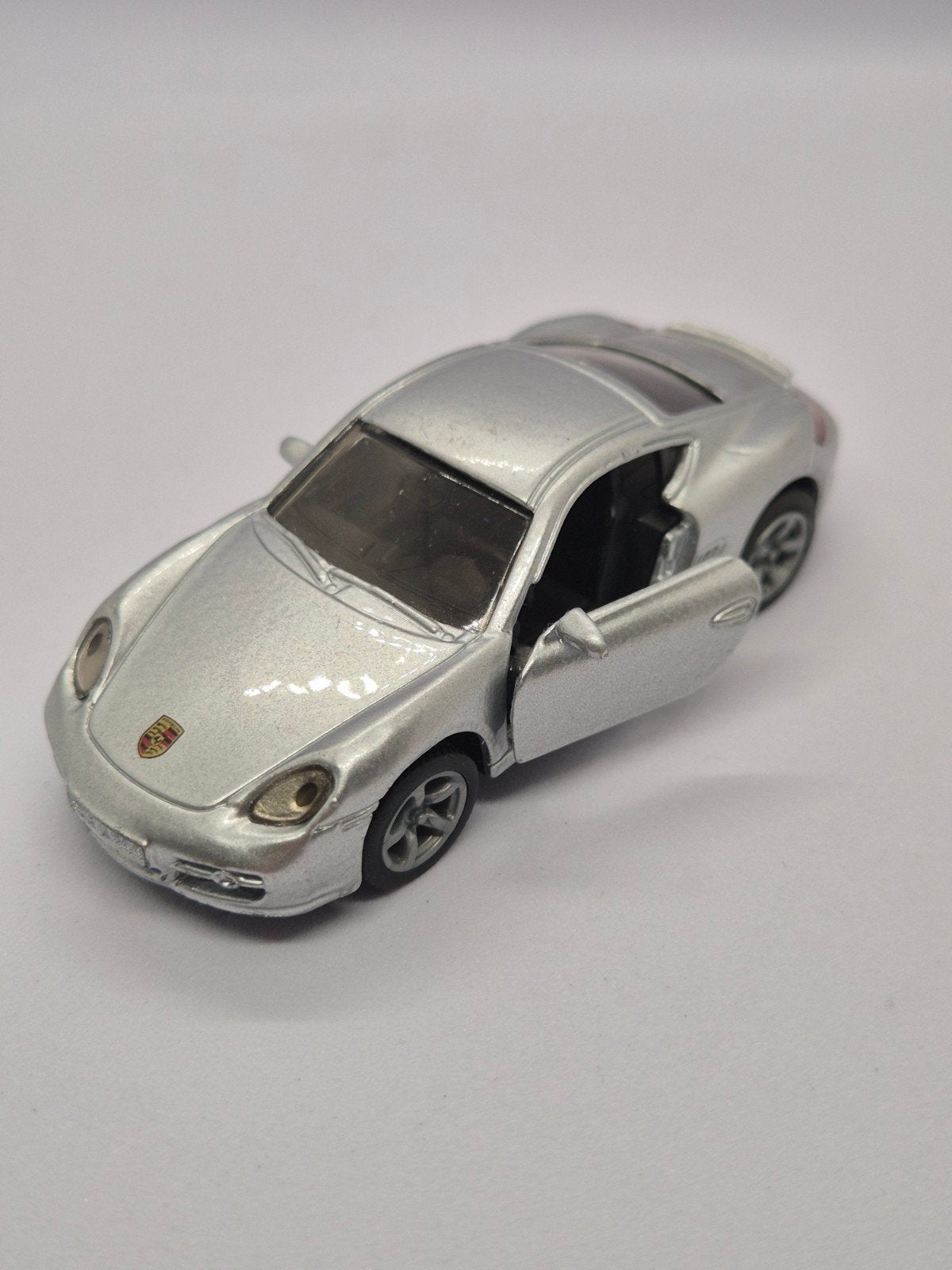 Siku Porsche Cayman S - Zilveren Speelgoedauto, Hobby en Vrije tijd, Ophalen of Verzenden, Zo goed als nieuw, Auto
