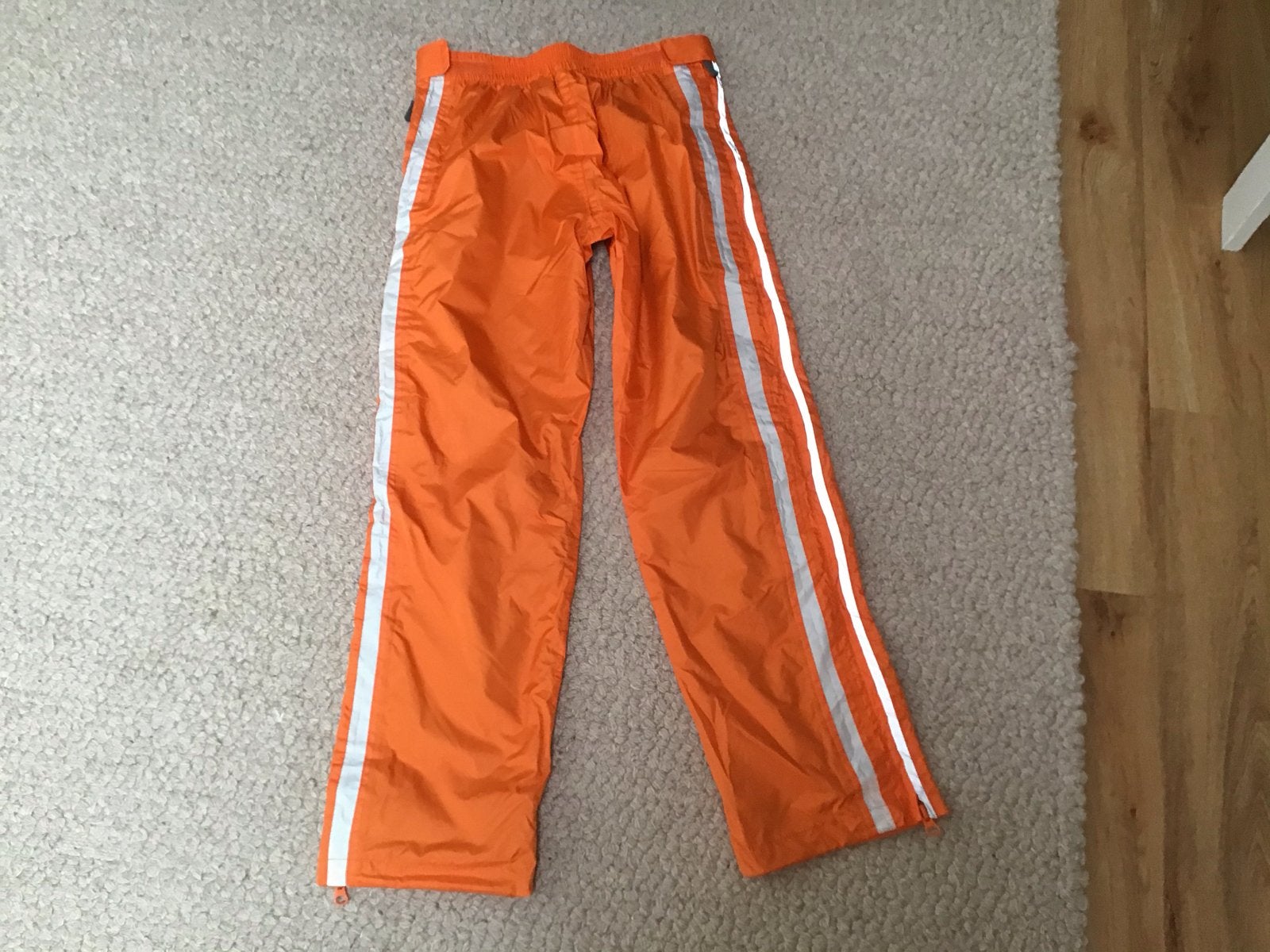 Dita sportbroek maat 164 - Oranje met reflecterende strepen, Ophalen of Verzenden, Gebruikt, Jongen of Meisje, Broek