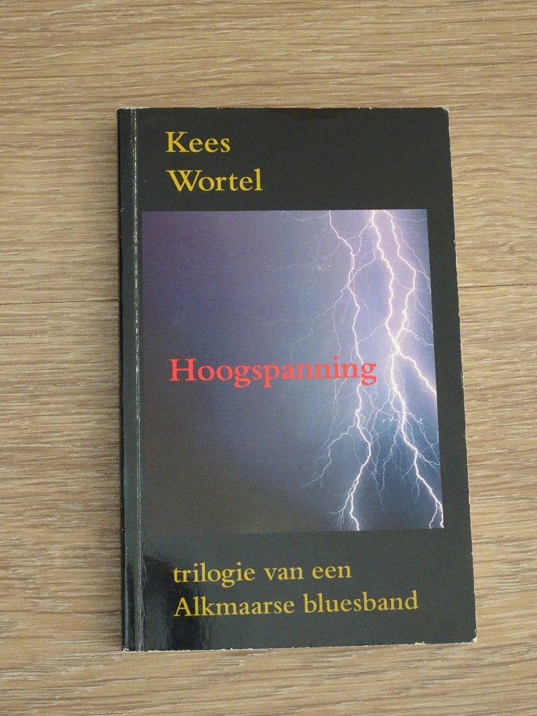 Kees Wortel Hoogspanning Trilogie v/e Alkmaarse Bluesband, Ophalen of Verzenden, Gelezen
