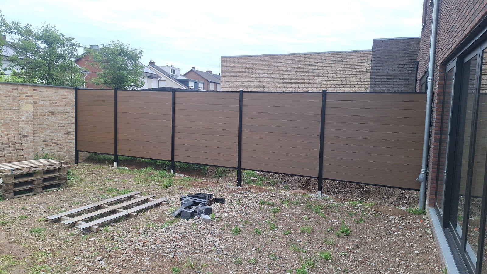 Composiet schutting Teak, Ophalen