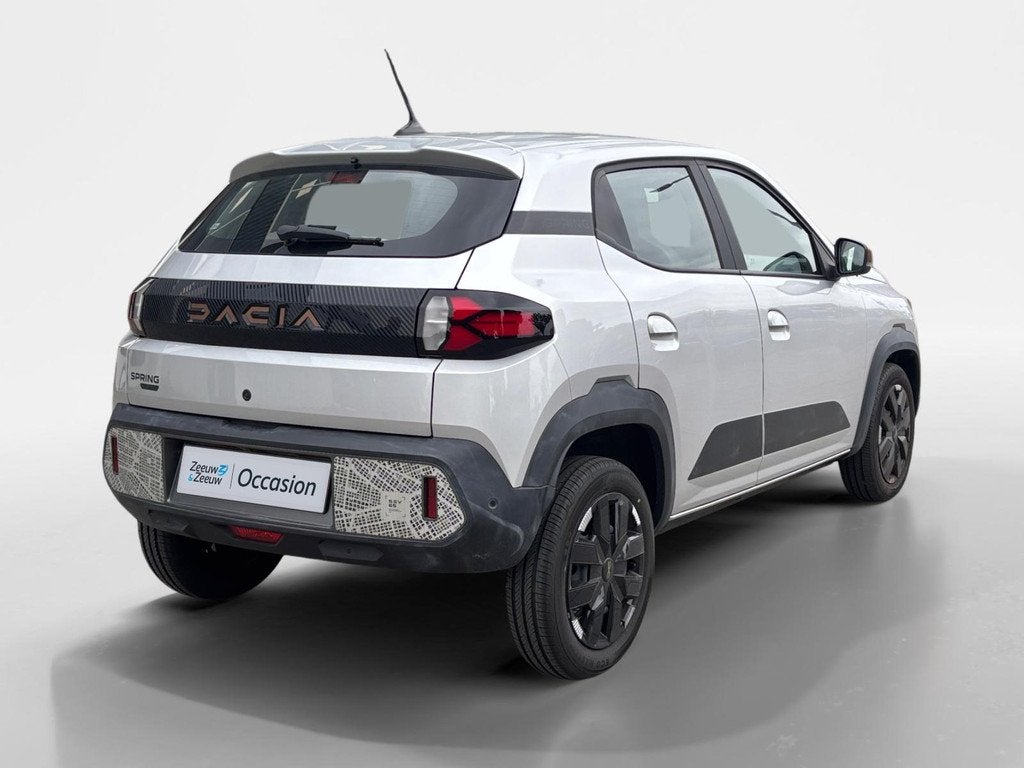 Dacia Spring Extreme 65 26.8 kWh AUTOMAAT NAVI AIRCO CAMERA, Auto's, Dacia, 12 maanden, Gebruikt, 4 stoelen, Leder en Stof