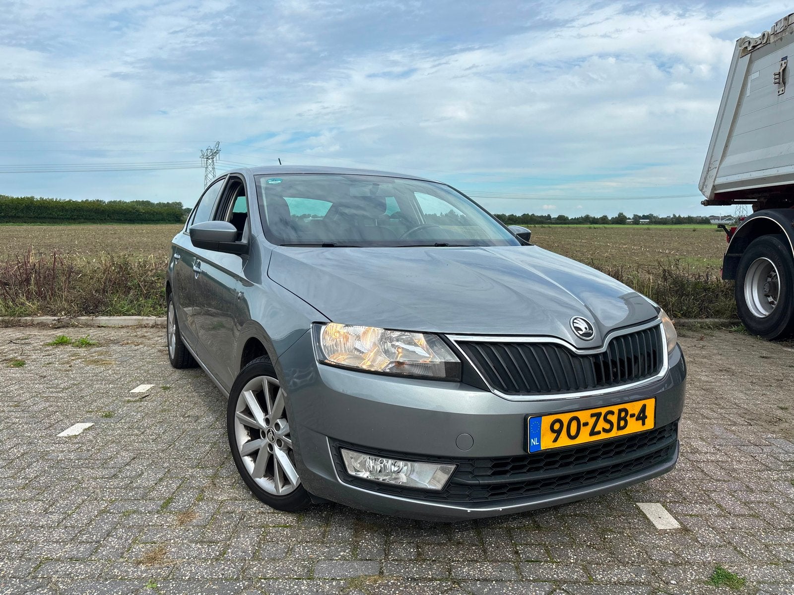 Skoda Rapid 1.2 TSI 63KW 2013 Grijs, Auto's, Voorwielaandrijving, Euro 5, Stof, Zwart