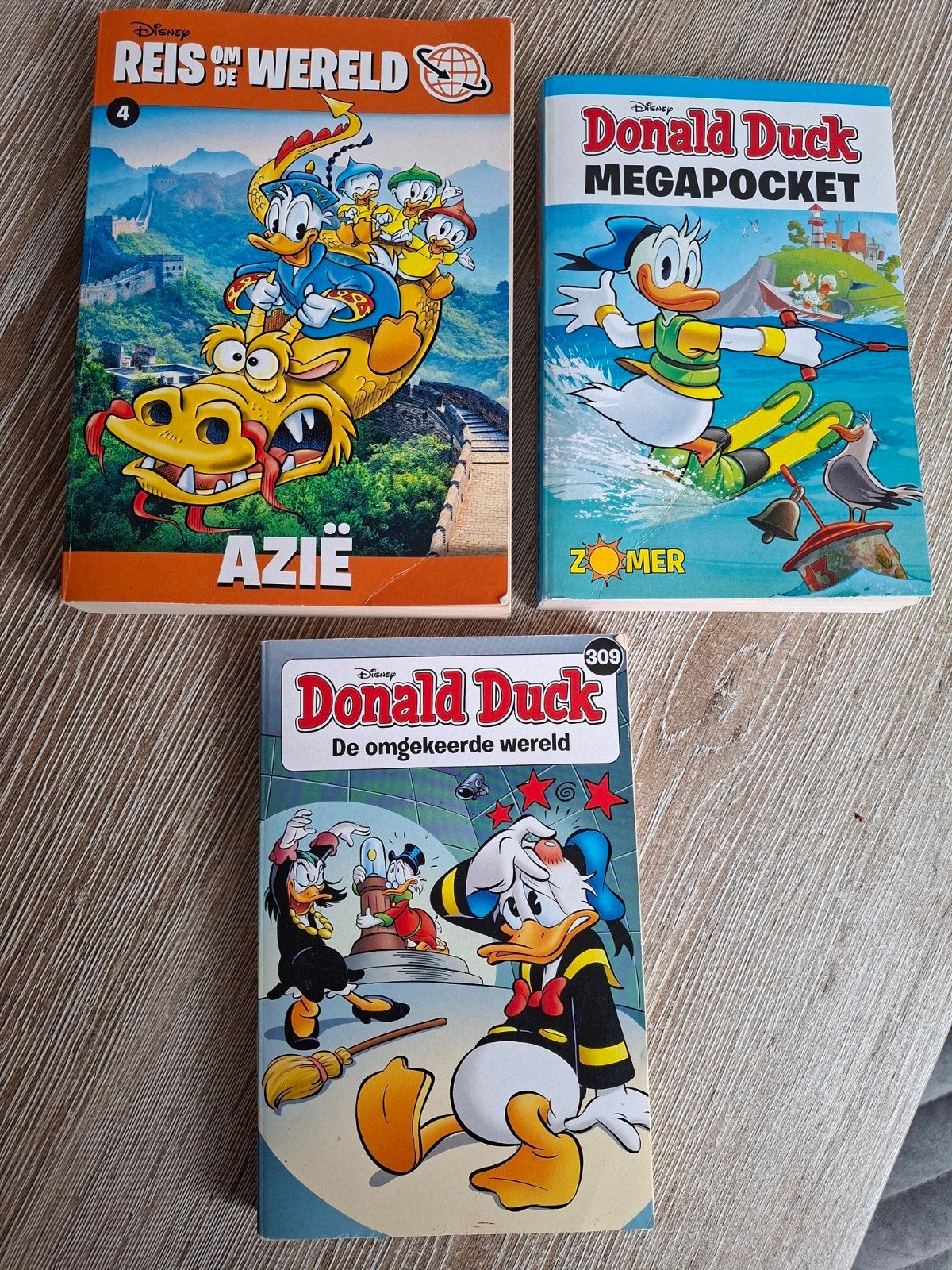 Donald Duck Megapocket en Reis om de Wereld stripboek, Boeken, Meerdere stripboeken, Ophalen of Verzenden, Zo goed als nieuw