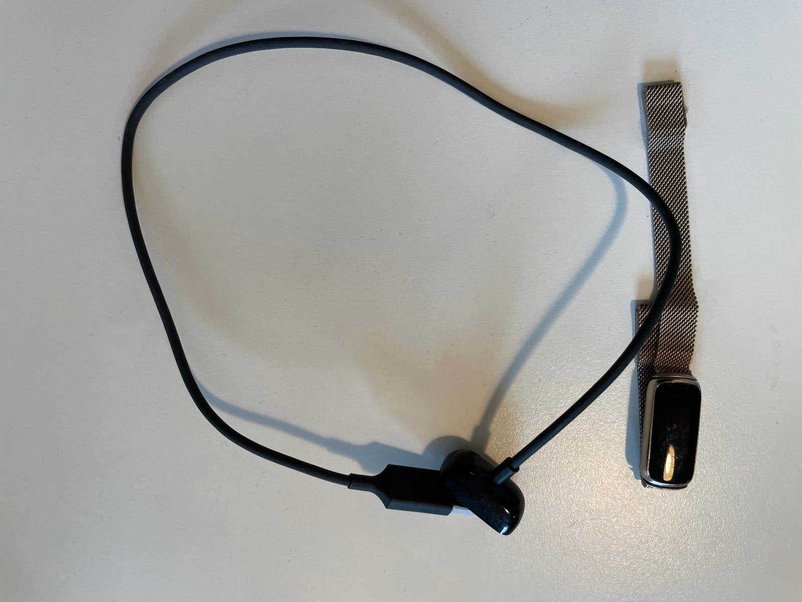 Niet meer werkende Fitbit Luxe met bandje en oplaadkabel, Ophalen of Verzenden, Gebruikt, Zwart, Android