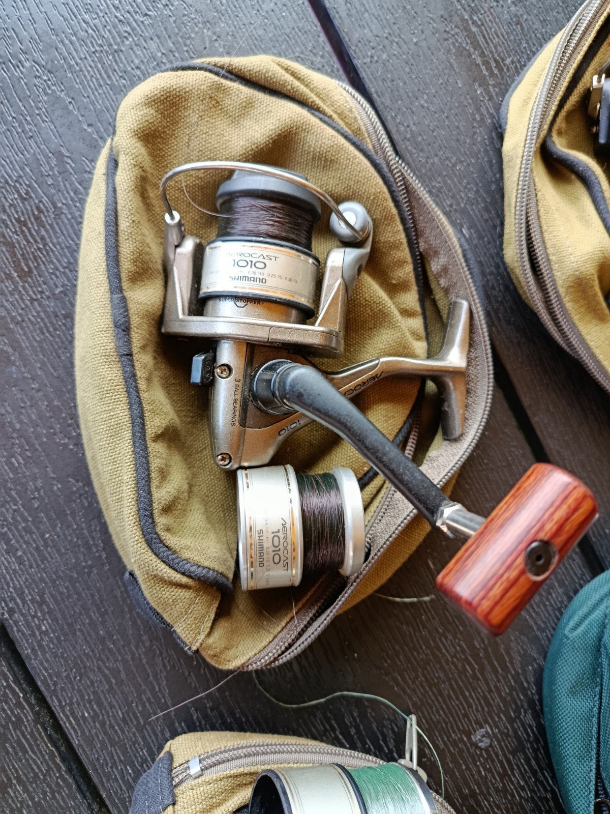 7 molens met tasjes en 7 hengels merk, Ophalen, Zo goed als nieuw, Complete set