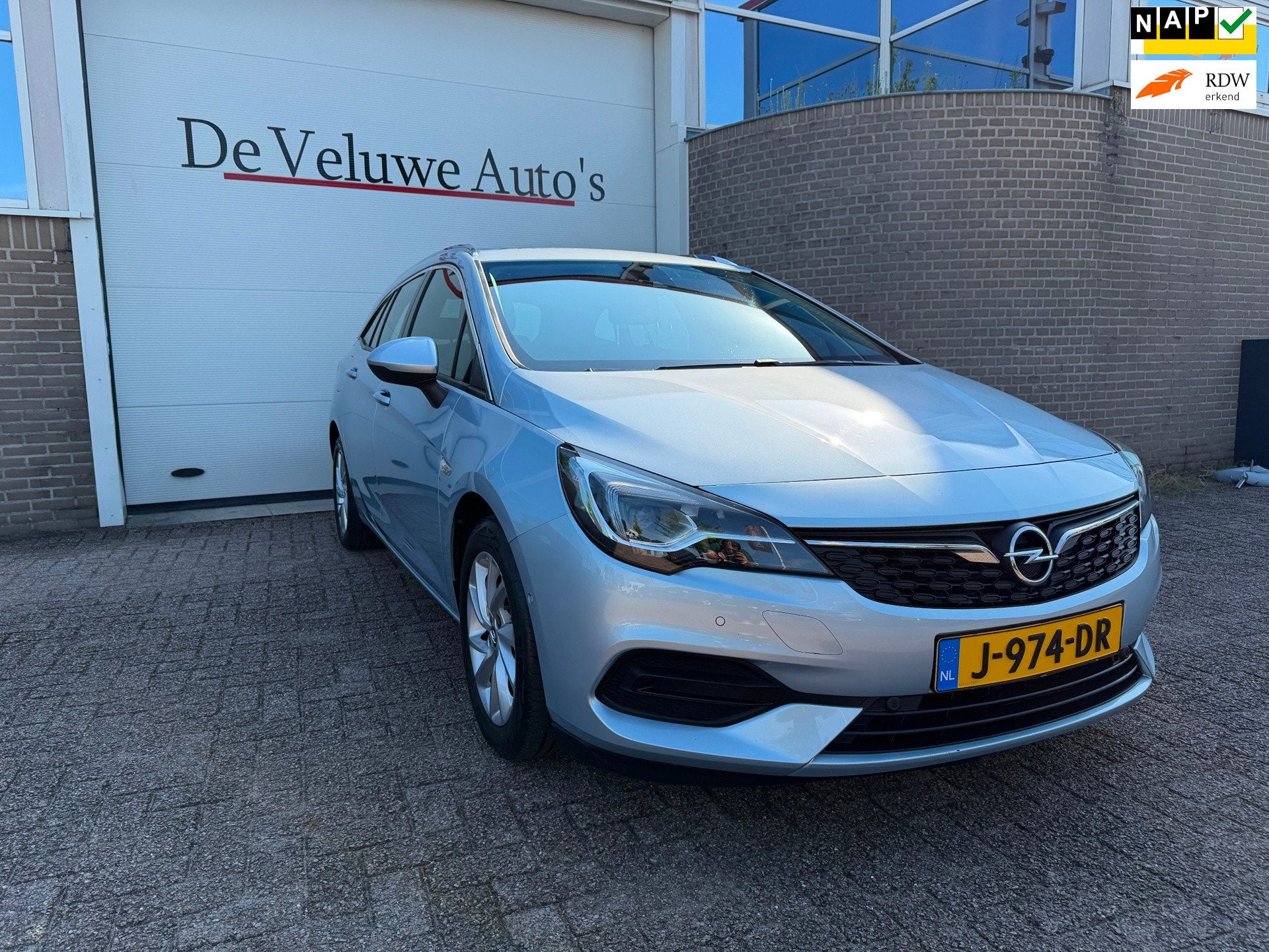 Opel Astra Sports Tourer 1.2 Elegance|PDC|Camera|Trekhaak, Voorwielaandrijving, Stof, 1199 cc, 23 km/l