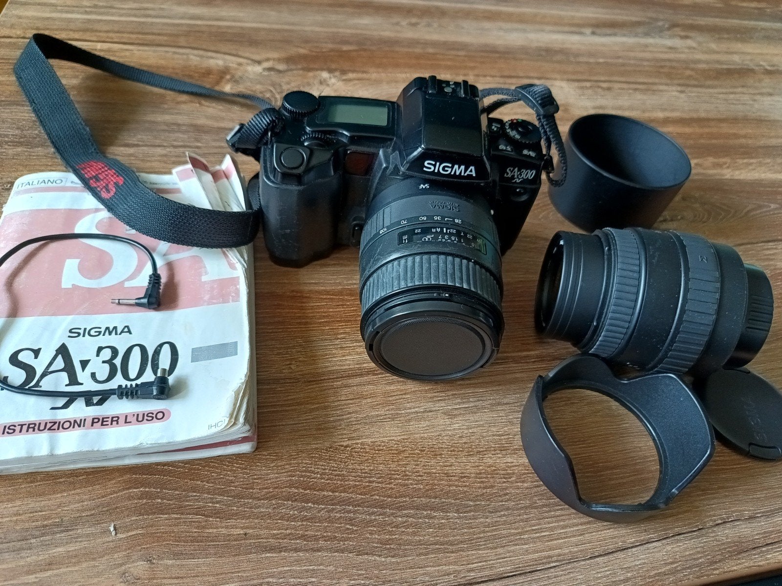 Sigma SA-300 Spiegelreflexcamera met 2 lenzen en handleiding, Ophalen of Verzenden, Gebruikt, Spiegelreflex, Overige Merken