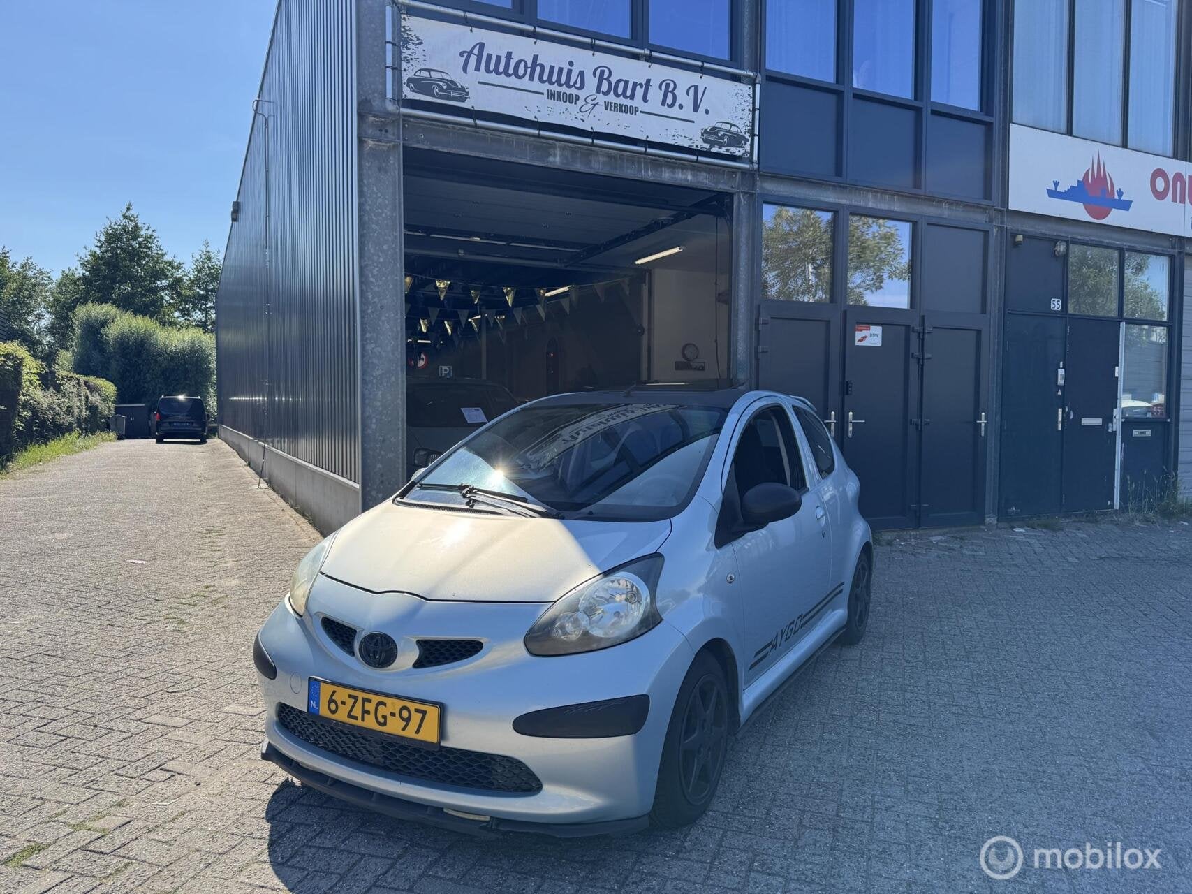 Toyota Aygo 1.0-12V + Nieuwe APK! NAP Rapport!, Voorwielaandrijving, Stof, Gebruikt, Zwart