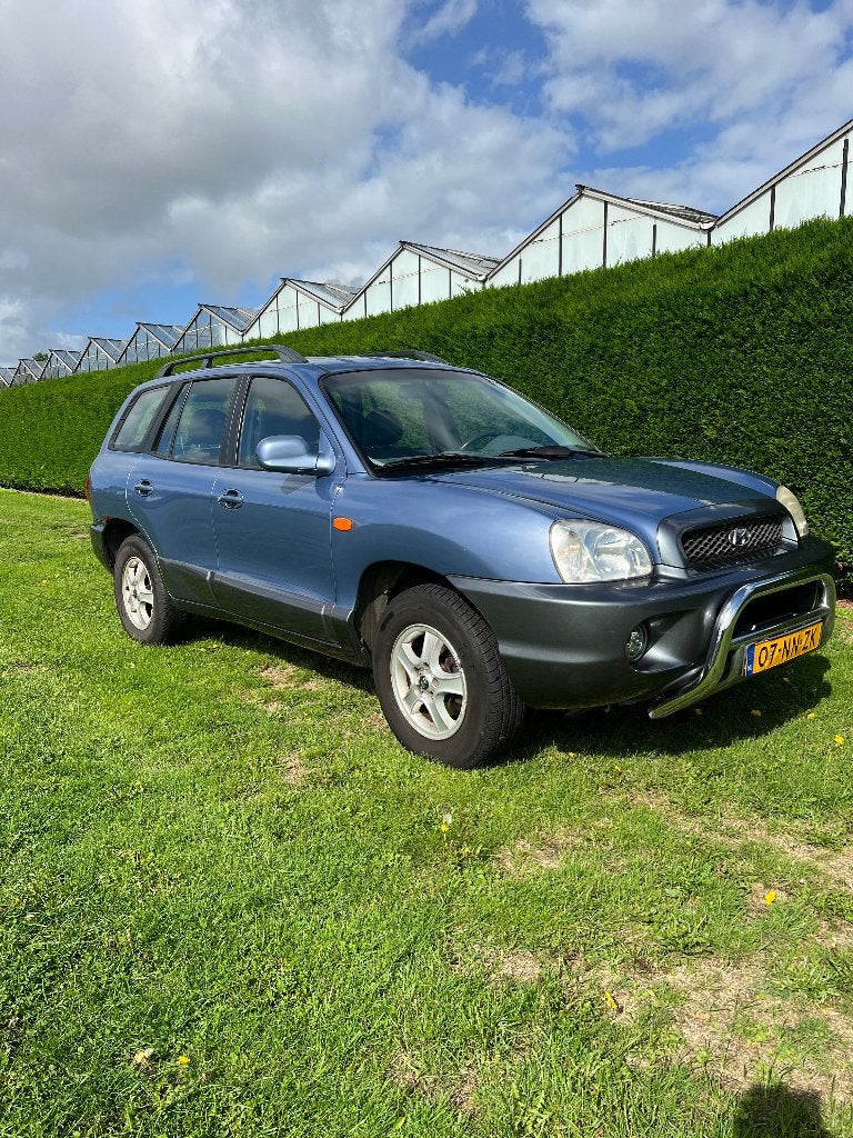 Hyundai Santa Fe 2.7 Country AUT 4WD 2004 Blauw, trekhaak, Auto's, Automaat, Santa Fe, Blauw, 2656 cc