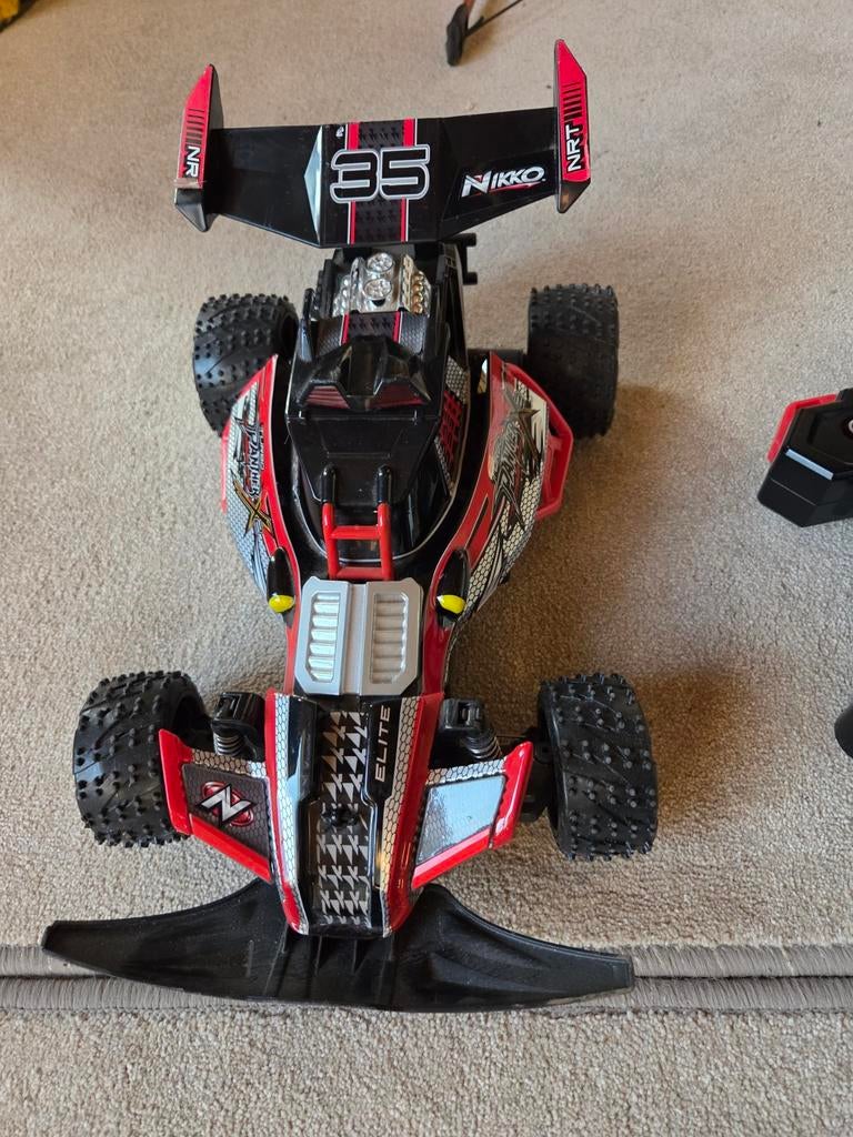 Bestuurbare auto Nikko, Hobby en Vrije tijd, Modelbouw | Radiografisch | Auto's, Ophalen, Zo goed als nieuw, Overige schalen, Auto offroad