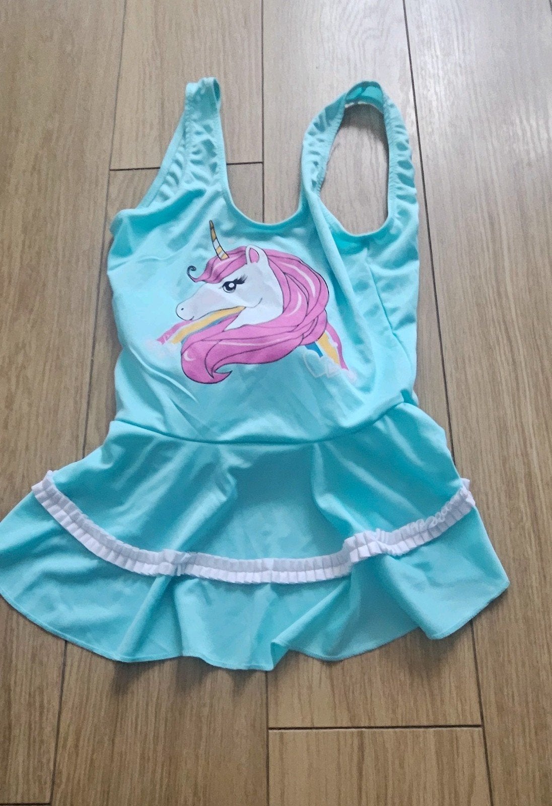 Eenhoorn zwempak maat 134, Kinderen en Baby's, Ophalen of Verzenden, Zo goed als nieuw, Meisje, Sport- of Zwemkleding