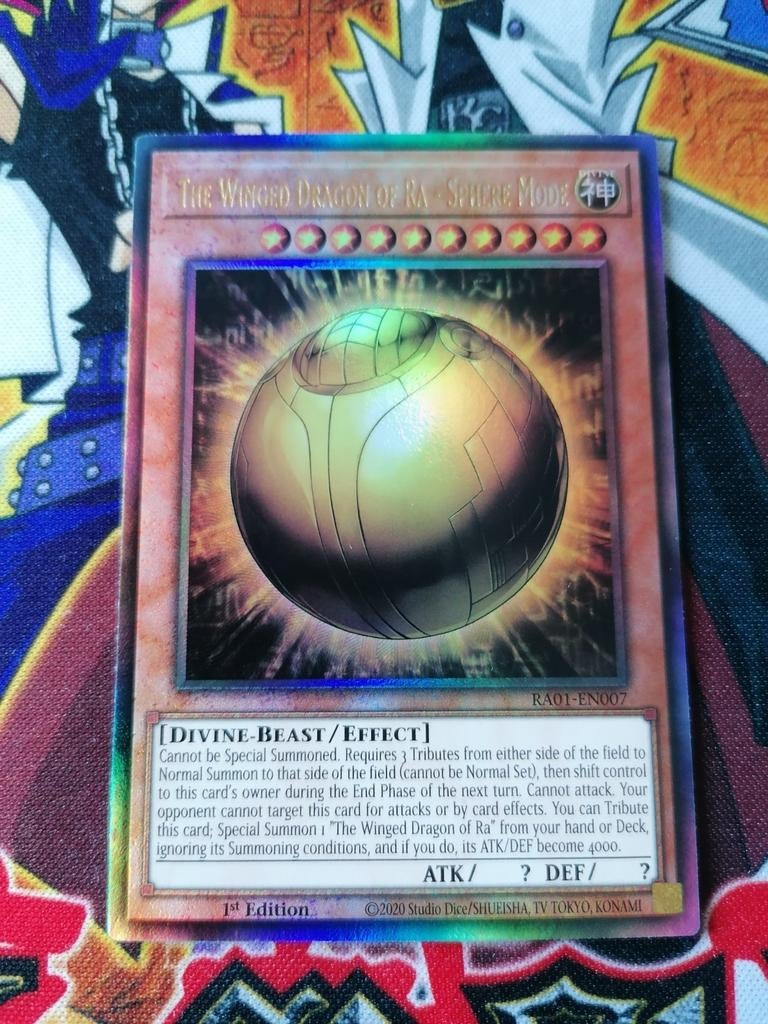 The Winged Dragon of Ra Sphere Mode - Ultimate Rare RA01 YGO, Ophalen of Verzenden, Zo goed als nieuw, Foil