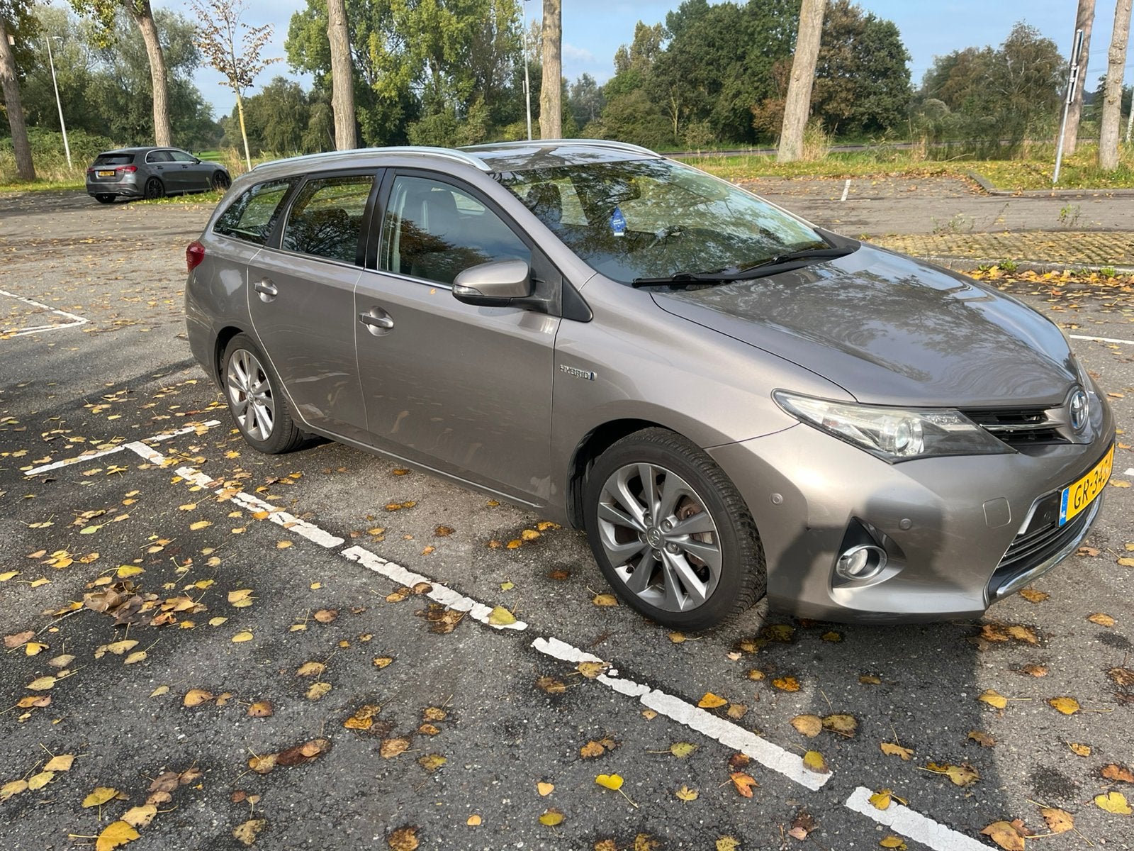 Toyota Auris 1.8 Hybrid Touring Sports CVT 2014 Bruin, Auto's, Dealer onderhouden, Zwart, Bruin, Leder en Stof