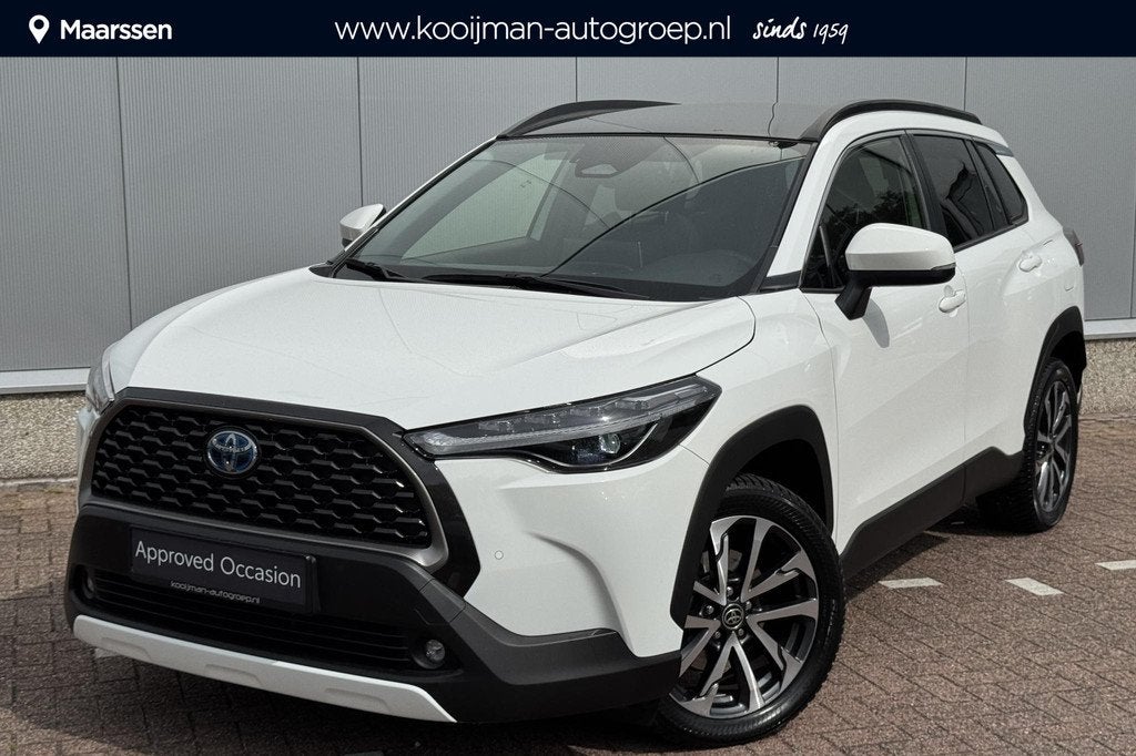 Toyota Corolla Cross 1.8 Hybrid Style Premium Pack II, Panor, Auto's, Gebruikt, 4 cilinders, Leder en Stof, Wit