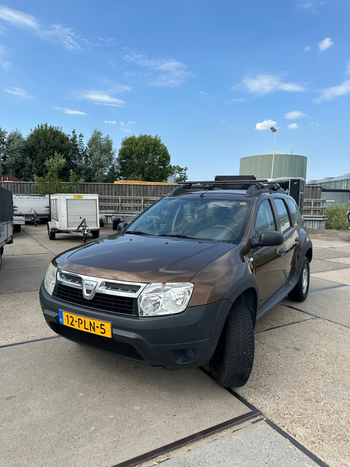 Dacia Duster 1.6 16V 74KW Benzine 2011 Bruin Lage KM stand, Auto's, Dacia, Voorwielaandrijving, 4 cilinders, 49 €/maand, 1200 kg