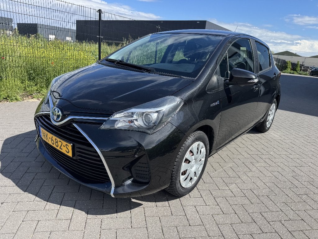 Toyota Yaris 1.5 Hybrid Automaat 2014, Auto's, 74 pk, 4 cilinders, Bedrijf, Grijs