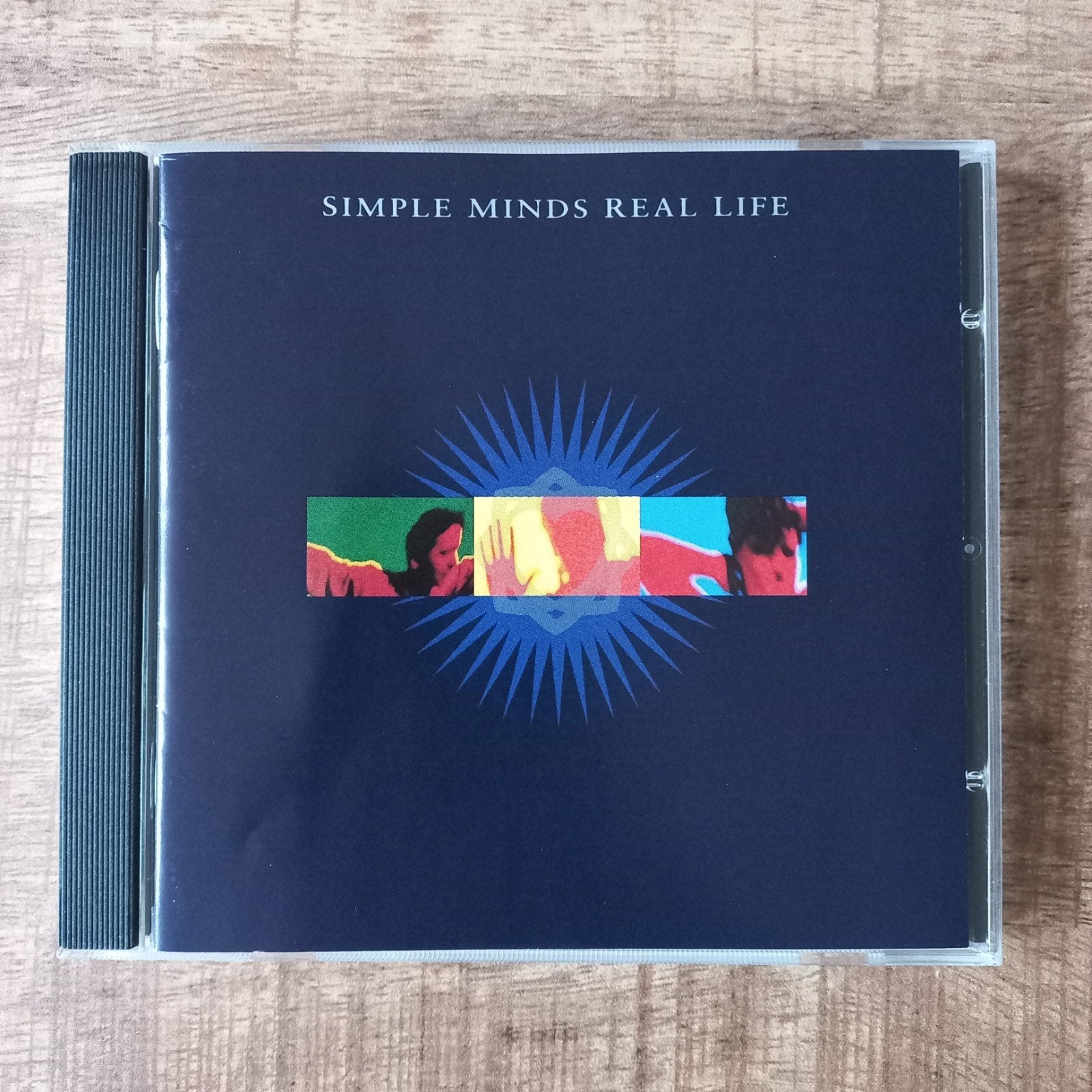 Simple Minds   -  Real Life, Inclusief boekje, Pop, Ophalen of Verzenden, Zo goed als nieuw