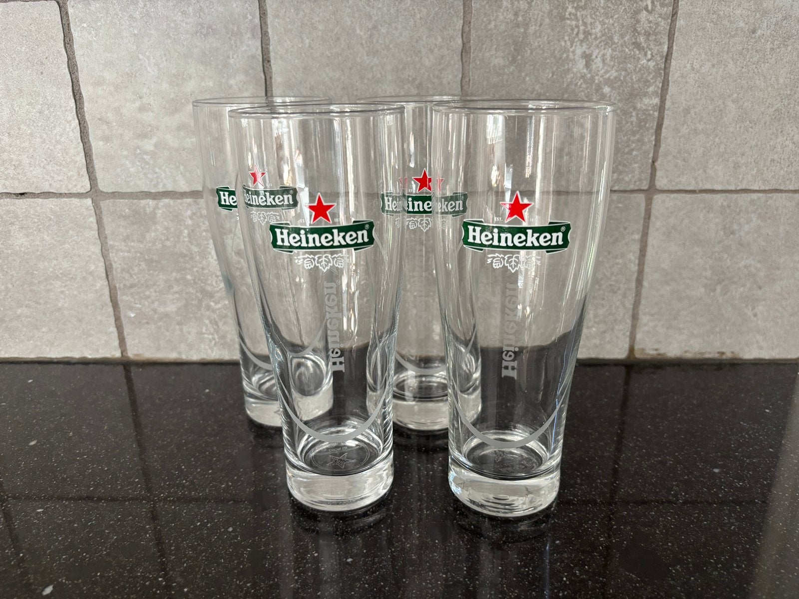 4 Heineken bierglazen - Zo goed als nieuw, Ophalen, Zo goed als nieuw, Meerkleurig, Overige merken