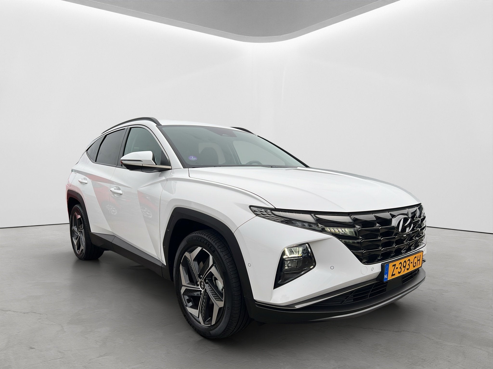 Hyundai Tucson 1.6 T-GDI 265pk PHEV Premium 4WD, Auto's, Hyundai, Gebruikt, 4 cilinders, Wit, Bedrijf