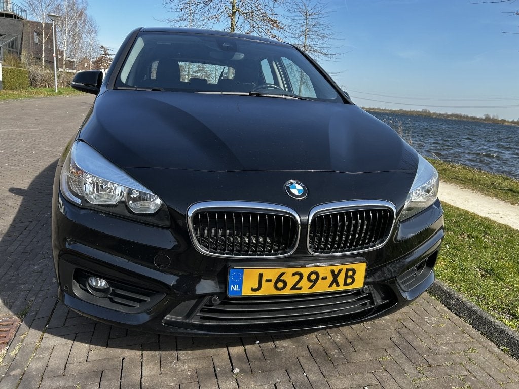 BMW 2-Serie Active Tourer 218i -automaat-dealer onderhouden, Auto's, BMW, 1345 kg, Zwart, Zwart, Particulier