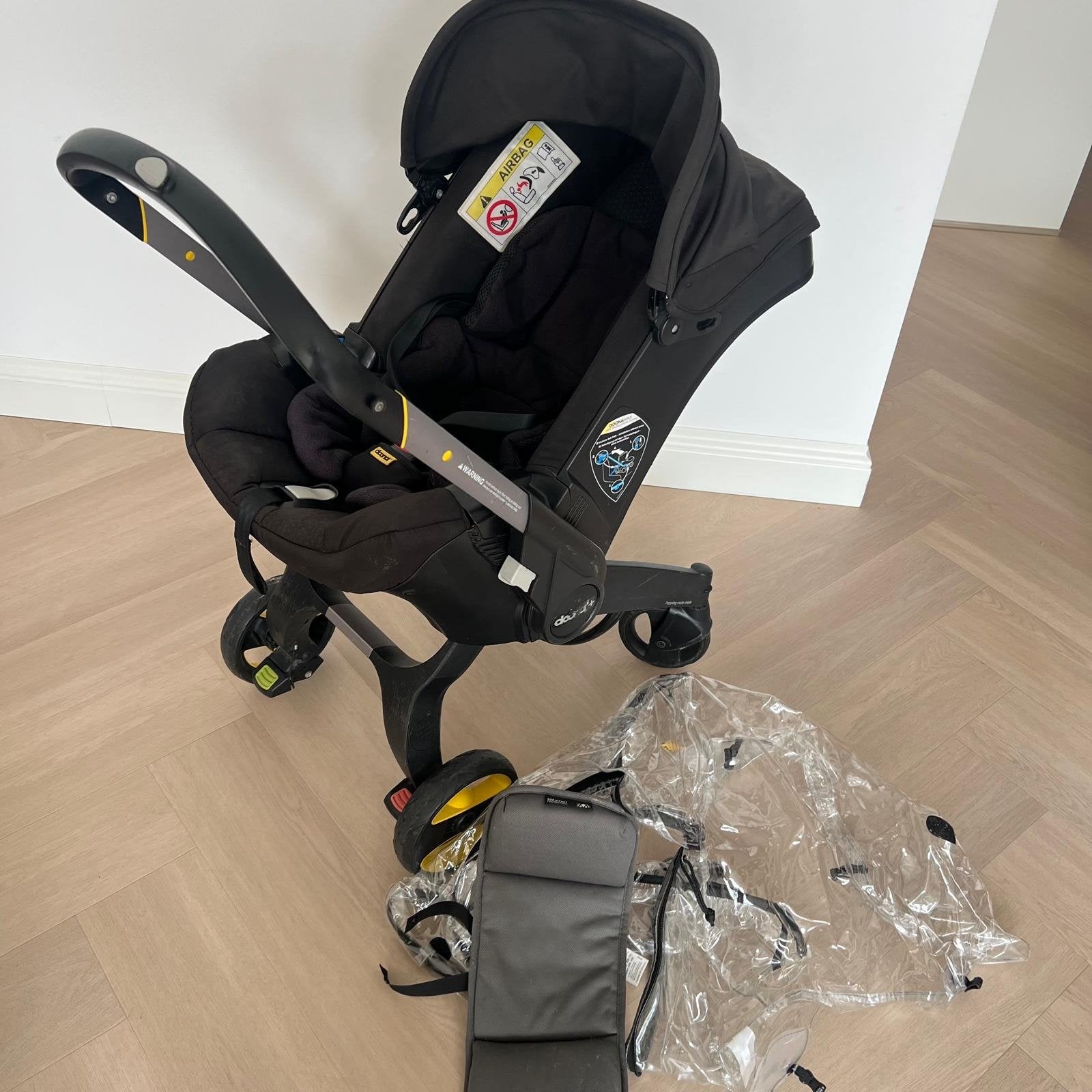 Doona+ autostoel en buggy in één, zwart, incl. regenhoes, Zijbescherming, 0 t/m 13 kg, Ophalen, Overige merken