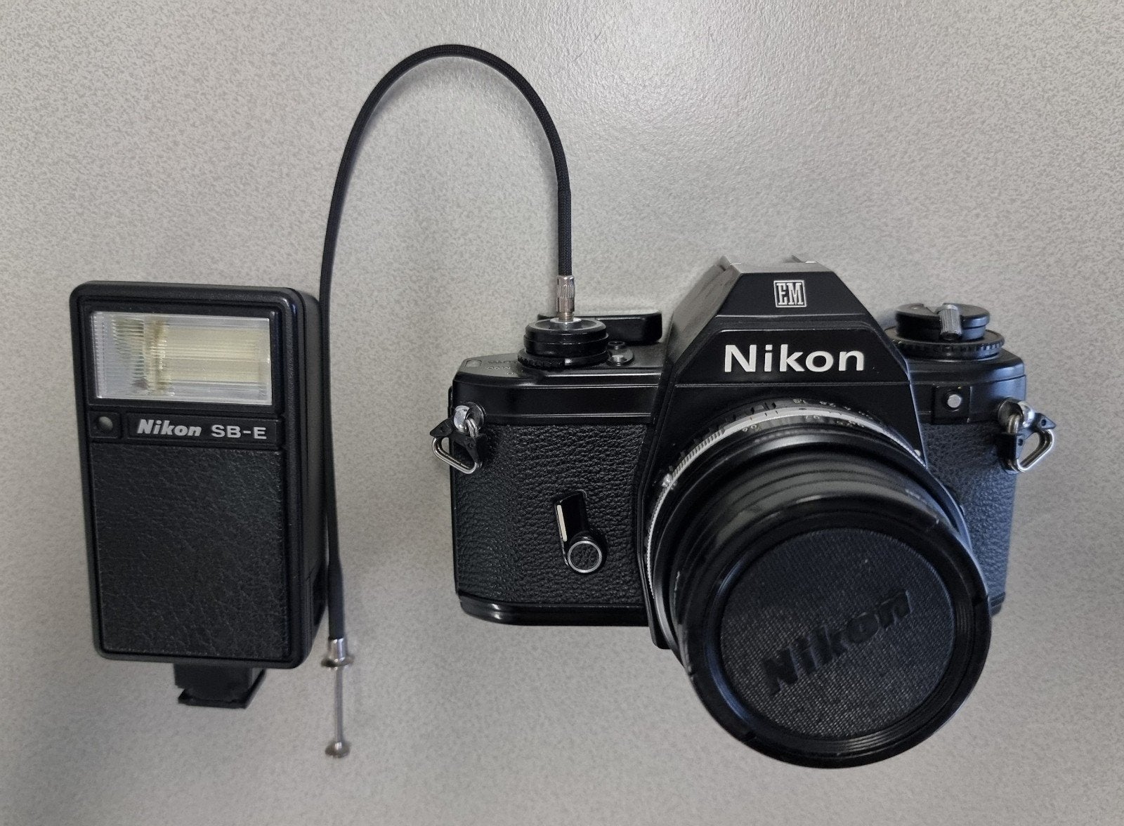 Nikon EM met 1.8 50mm lens plus voorzetglaasjes., Ophalen of Verzenden, Spiegelreflex, Nikon