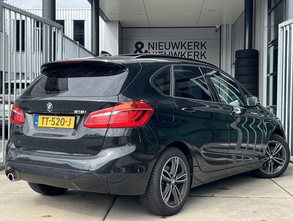 BMW 2 Serie Active Tourer 218i High Executive | AUTOMAAT | P, Auto's, BMW, Gebruikt, Met garantie (alle), Zwart, 3 cilinders