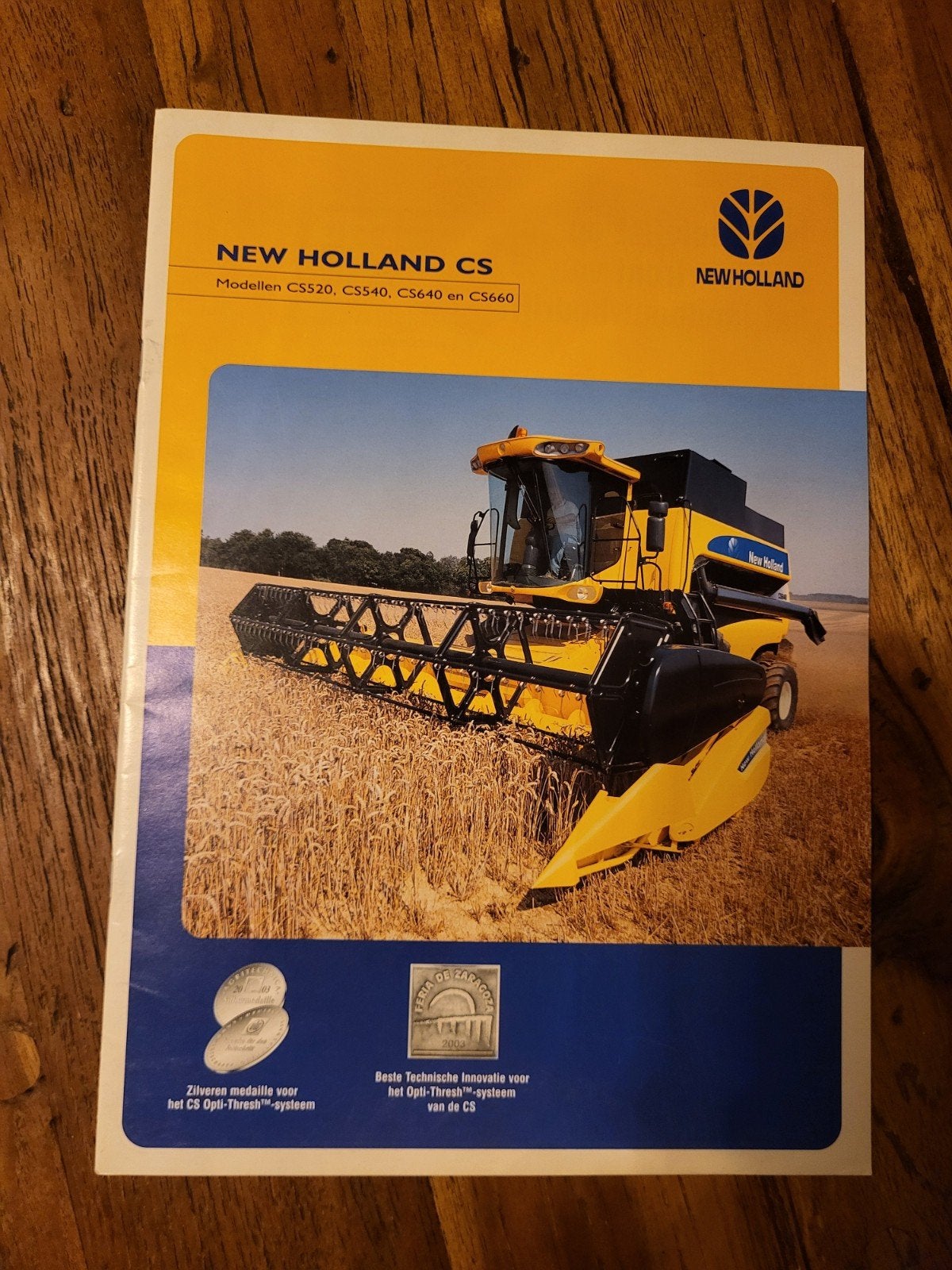 tractor folder New Holland CS combine, Ophalen of Verzenden, Zo goed als nieuw