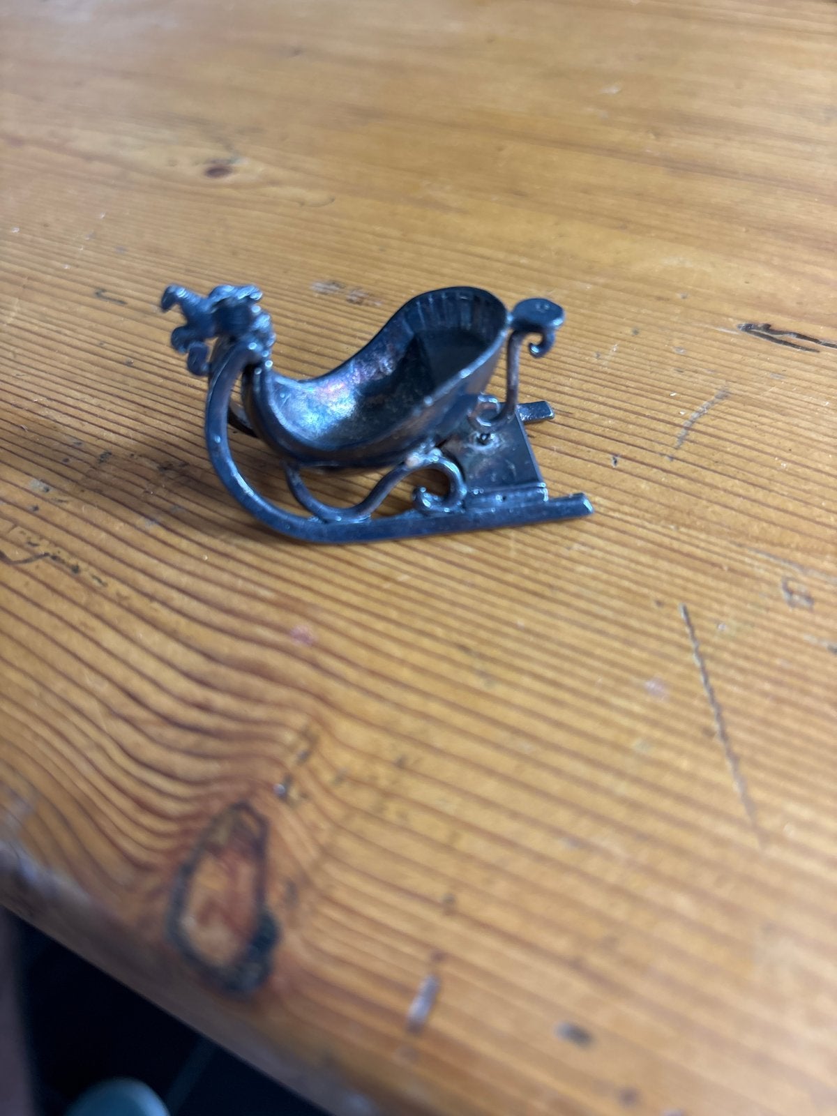 Antieke zilveren slee miniatuur, Ophalen