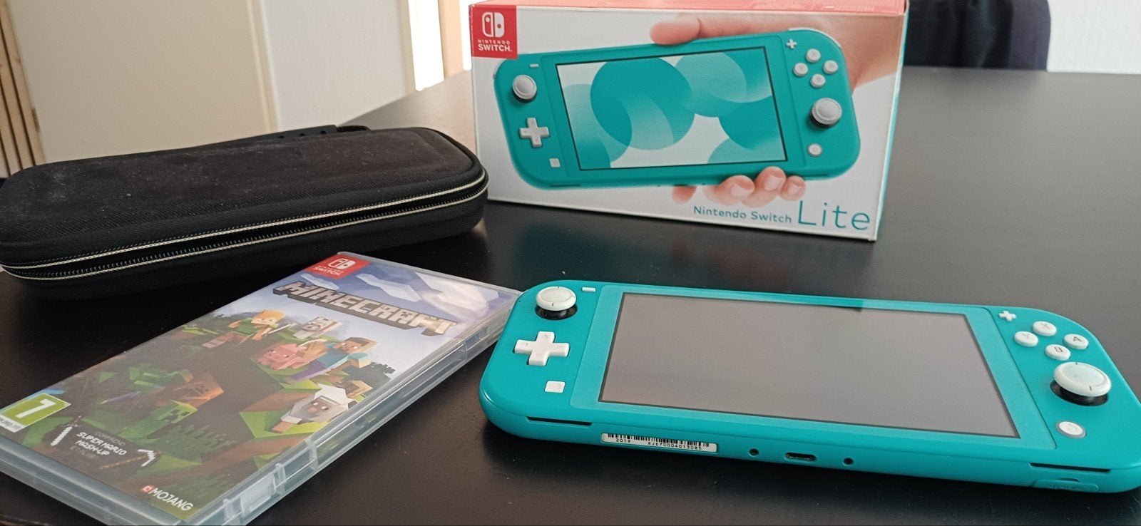 Nintendo Switch Lite Turquoise met Minecraft en opbergmap, Ophalen of Verzenden, Zonder controller, Switch Original, Gebruikt